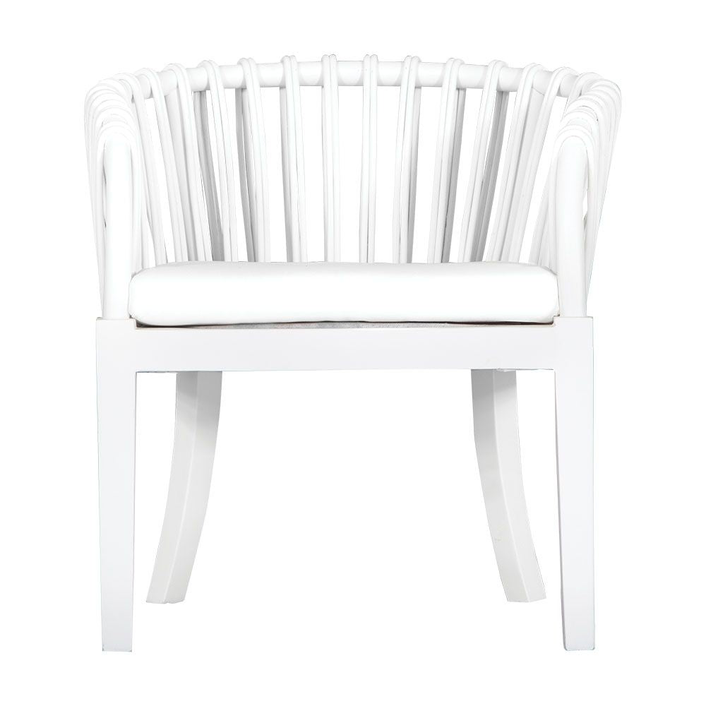 Makena chair in white rattan with a linen seat cushion, featuring a curved backrest and sturdy timber frame, perfect for a relaxed dining setting