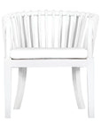 Makena chair in white rattan with a linen seat cushion, featuring a curved backrest and sturdy timber frame, perfect for a relaxed dining setting