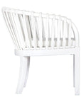Makena chair in white rattan with a linen seat cushion, featuring a curved backrest and sturdy timber frame, perfect for a relaxed dining setting
