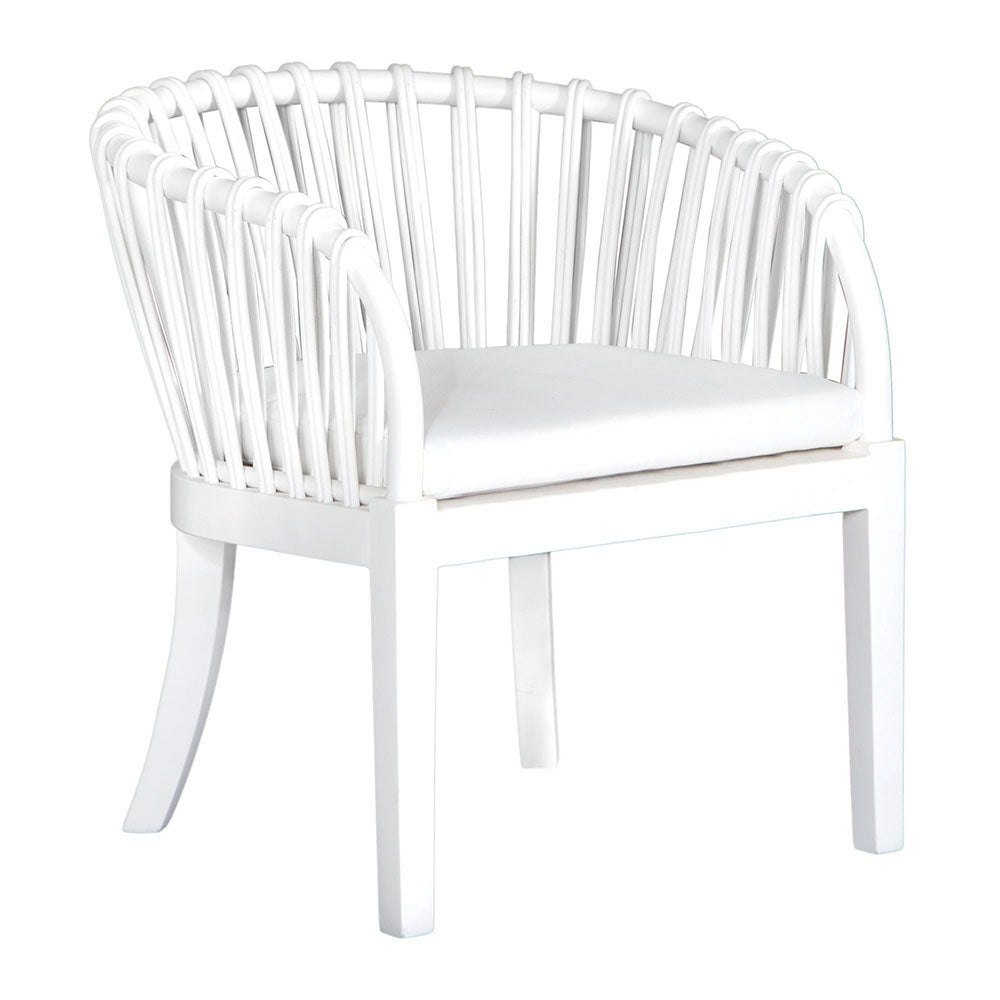 Makena chair in white rattan with a linen seat cushion, featuring a curved backrest and sturdy timber frame, perfect for a relaxed dining setting