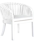 Makena chair in white rattan with a linen seat cushion, featuring a curved backrest and sturdy timber frame, perfect for a relaxed dining setting