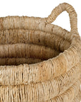 Mara natural handwoven storage basket with integrated handles in warm textured fibre set on a neutral background