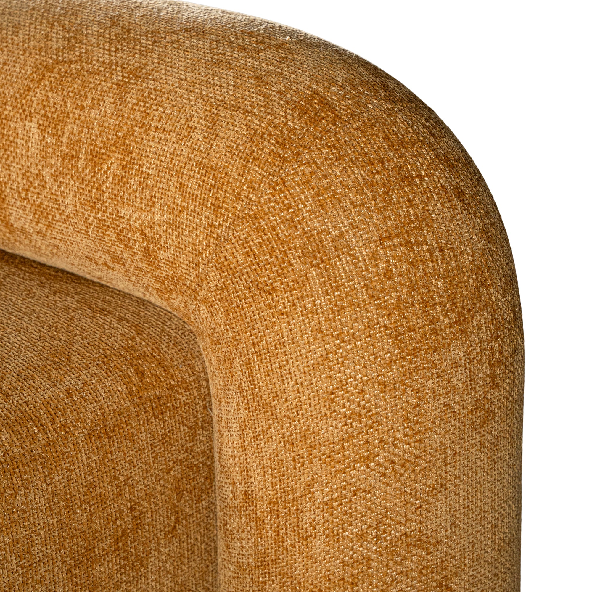 A luxurious mustard lounge chair with a sculptural, curved backrest and a matching ottoman, offering a bold yet elegant statement piece for contemporary interiors.