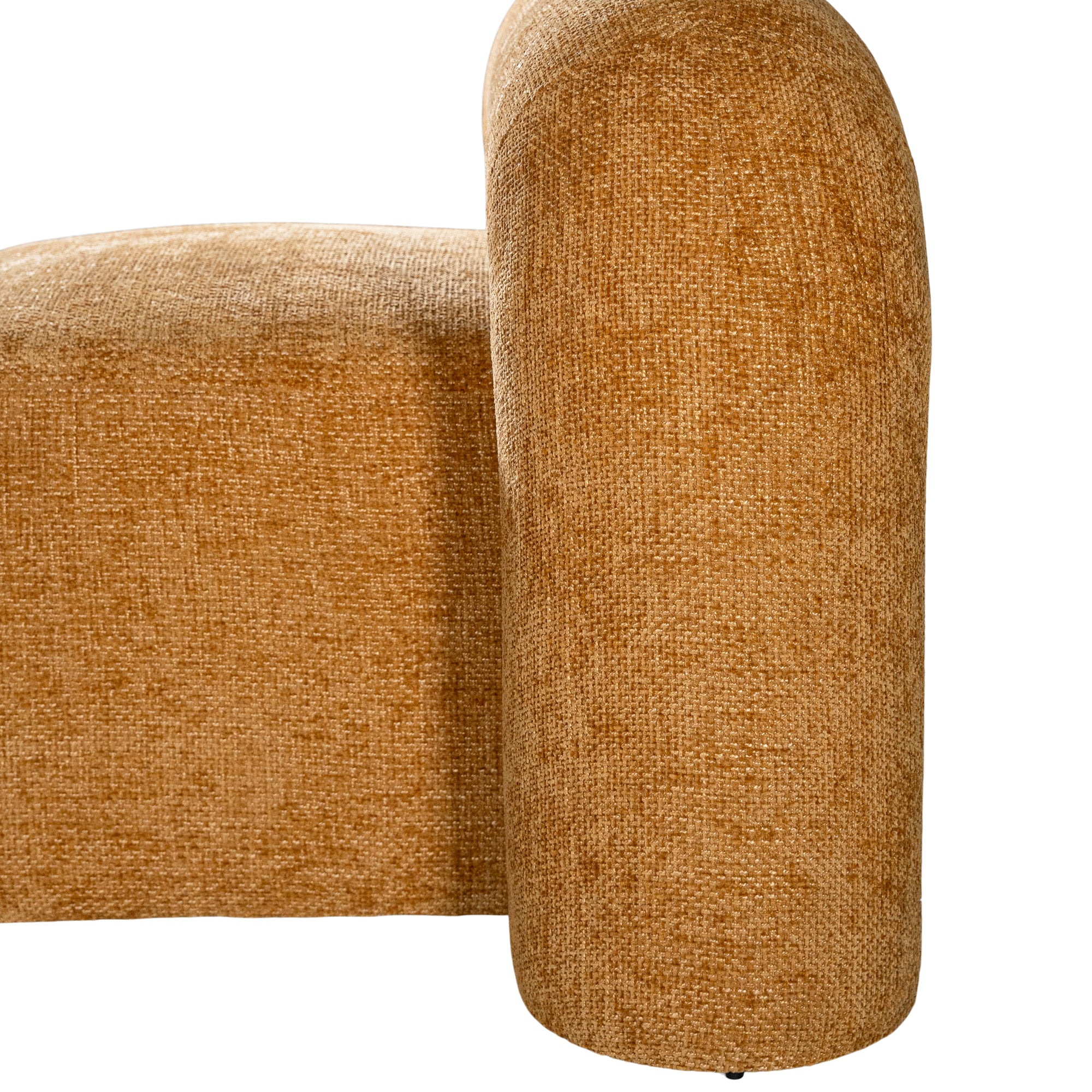 A luxurious mustard lounge chair with a sculptural, curved backrest and a matching ottoman, offering a bold yet elegant statement piece for contemporary interiors.