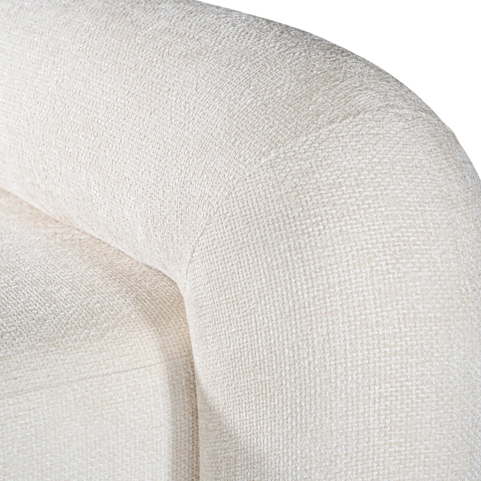 A luxurious white lounge chair with a sculptural, curved backrest and a matching ottoman, offering a bold yet elegant statement piece for contemporary interiors