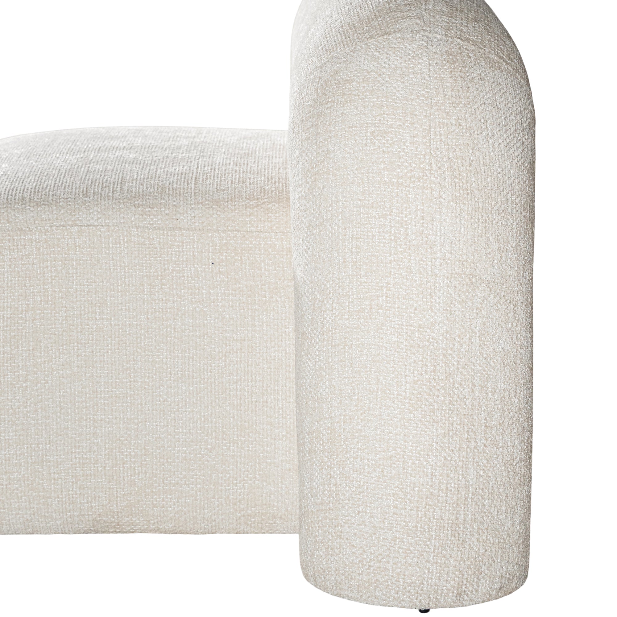 A luxurious white lounge chair with a sculptural, curved backrest and a matching ottoman, offering a bold yet elegant statement piece for contemporary interiors