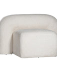A luxurious white lounge chair with a sculptural, curved backrest and a matching ottoman, offering a bold yet elegant statement piece for contemporary interiors