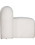 A luxurious white lounge chair with a sculptural, curved backrest and a matching ottoman, offering a bold yet elegant statement piece for contemporary interiors