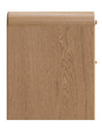 A modern oak bedside table from KULALA Living, featuring a curved silhouette and storage drawers. Crafted from natural wood, this minimalist piece enhances any bedroom with its warm, organic aesthetic