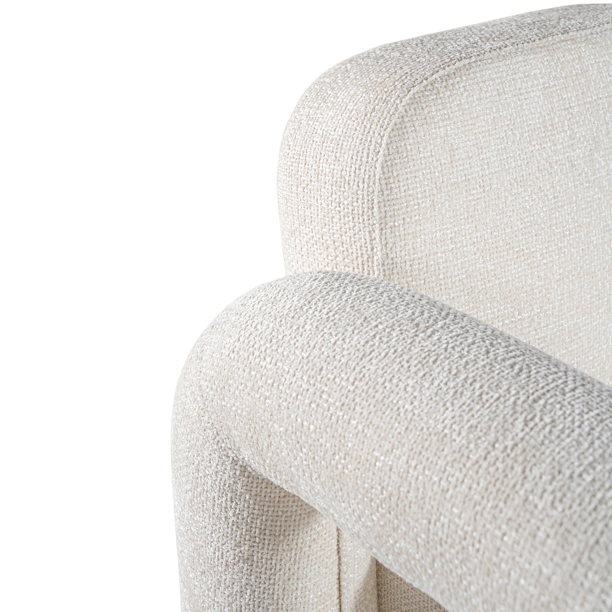 A modern sculptural armchair with rounded, chunky arms and backrest, upholstered in soft white boucle fabric, perfect for contemporary living spaces