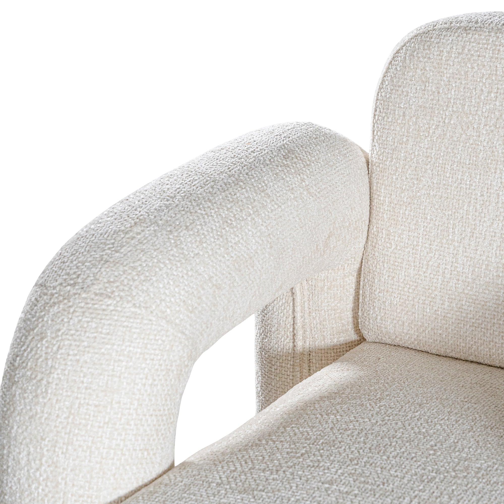 A modern sculptural armchair with rounded, chunky arms and backrest, upholstered in soft white boucle fabric, perfect for contemporary living spaces