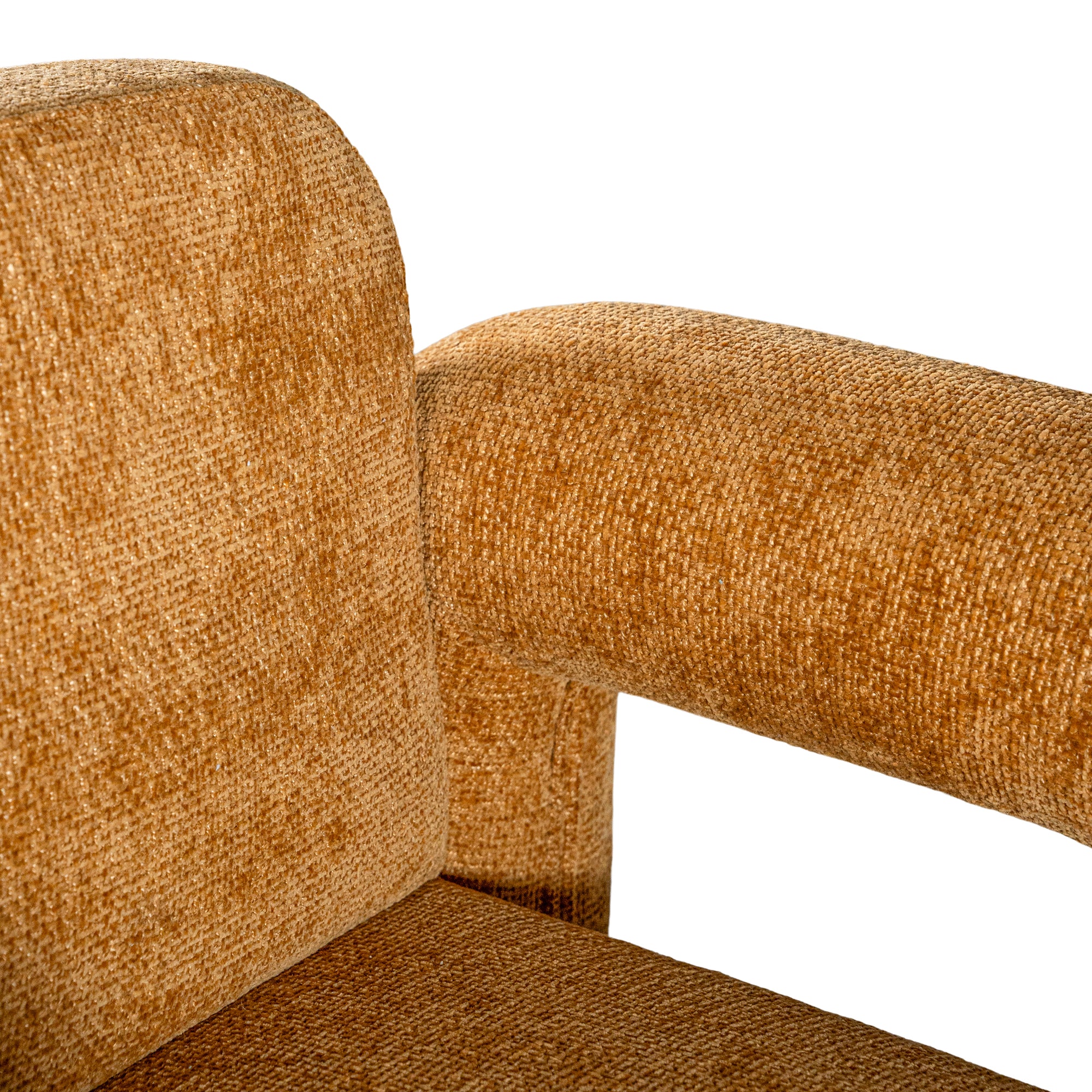 A modern sculptural armchair with rounded, chunky arms and backrest, upholstered in mustard boucle fabric, perfect for contemporary living spaces