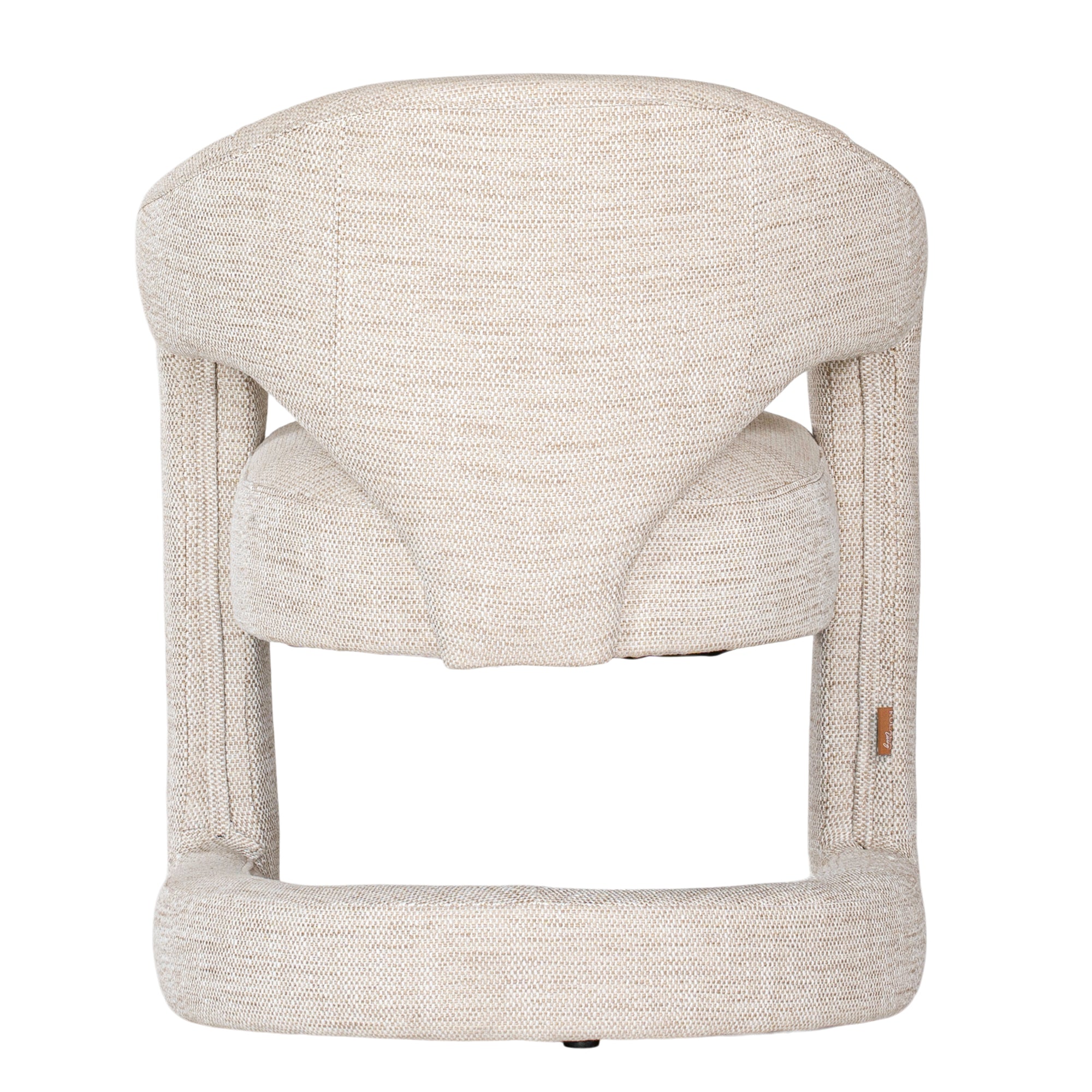Contemporary upholstered armchair in a soft beige fabric, featuring a sculptural curved frame and plush seating for a modern, sophisticated look.