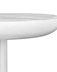 A contemporary white side table with a smooth, rounded top and a textured dome-shaped base, offering a modern and sculptural design
