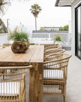 Nakula rattan dining chairs styled around a timber outdoor table in a relaxed mediterranean inspired australian setting