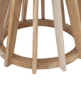 Nakuru side table in natural teak with round glass top and sculptural slat base isolated on a light background