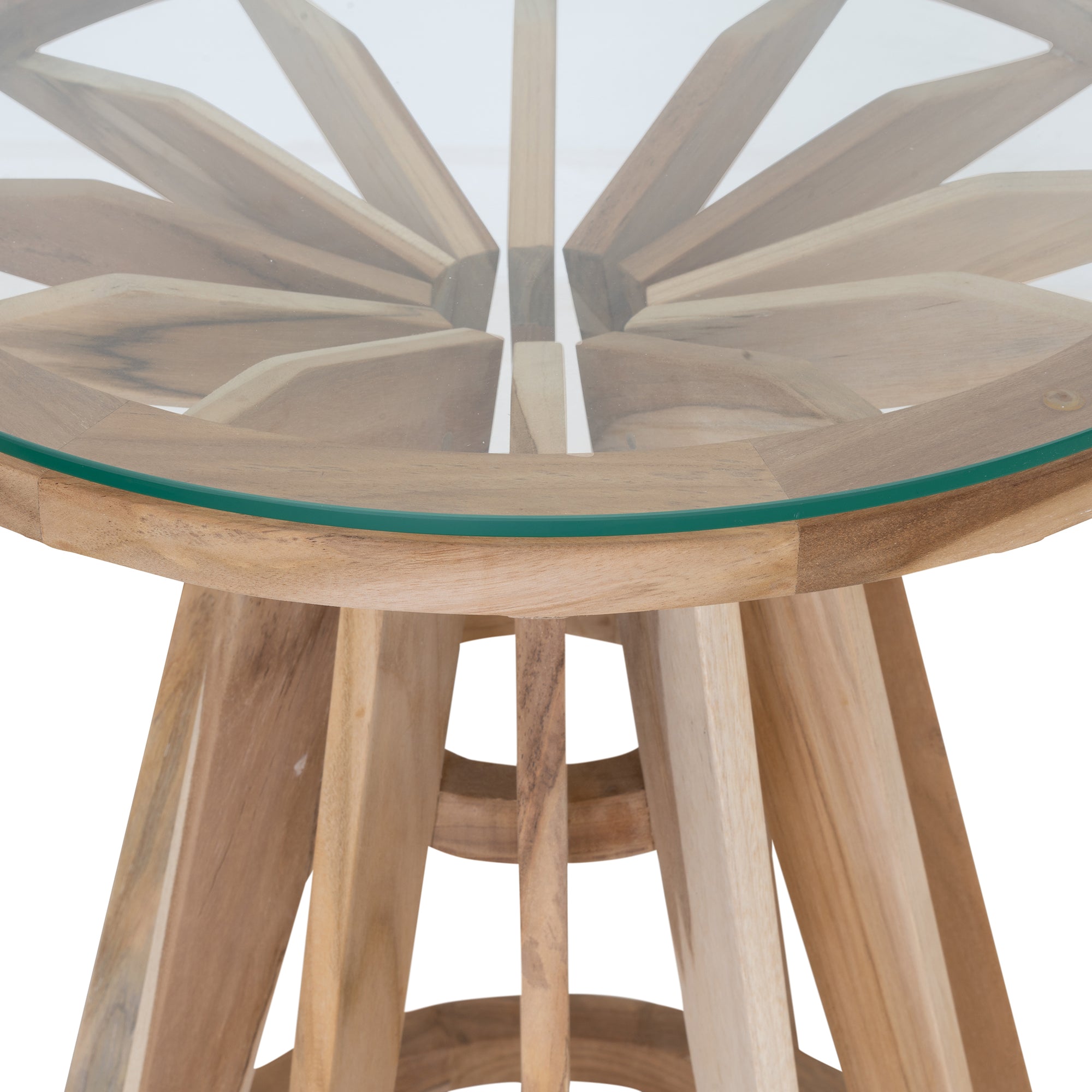 Nakuru side table in natural teak with round glass top and sculptural slat base isolated on a light background