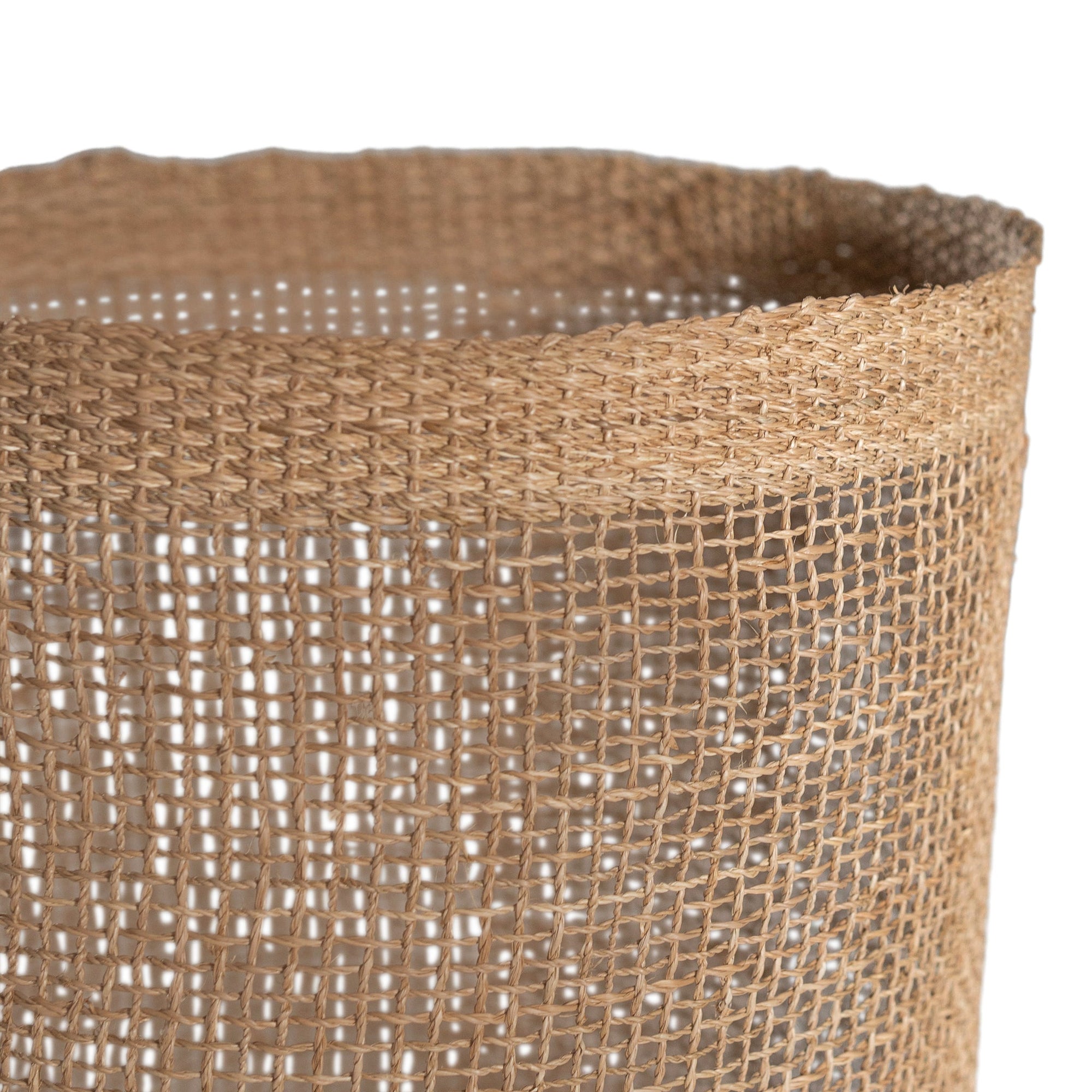 Natural jute storage baskets with open weave design, perfect for stylish organisation and coastal decor.