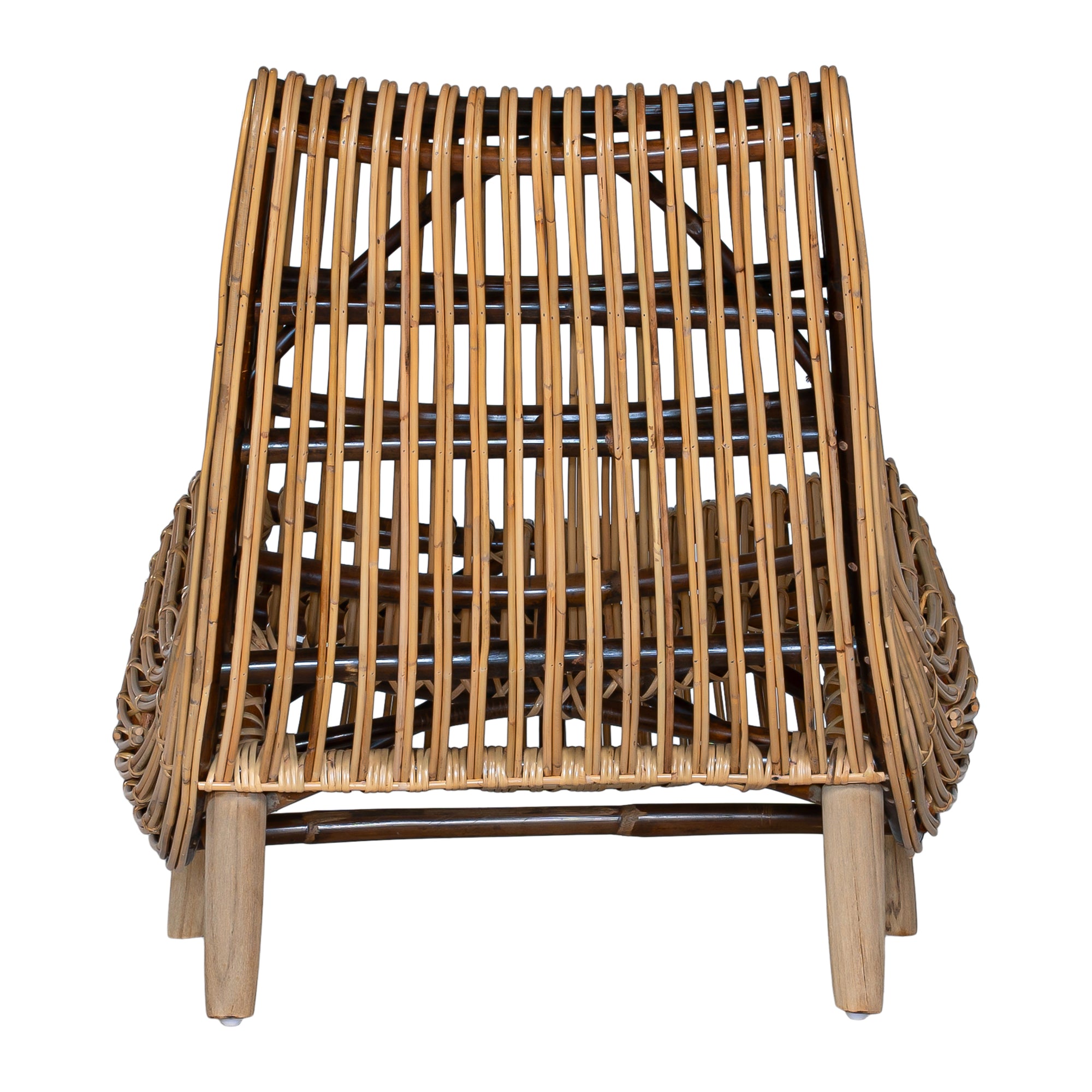 A sculptural natural rattan lounge chair with a curved, low-profile silhouette and sleek wooden legs. The woven design adds texture, while the deep seat and ergonomic shape offer comfort and relaxation