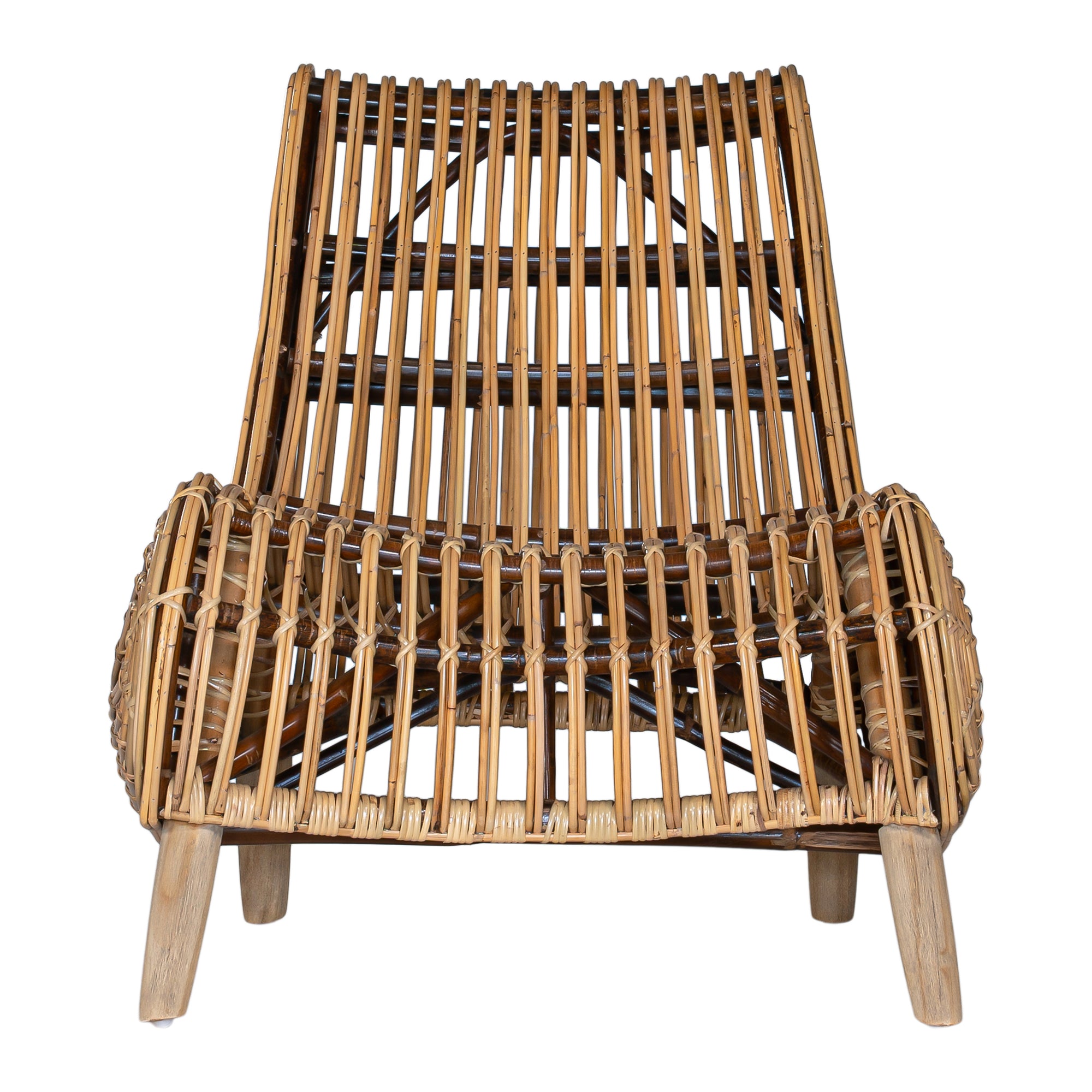 A sculptural natural rattan lounge chair with a curved, low-profile silhouette and sleek wooden legs. The woven design adds texture, while the deep seat and ergonomic shape offer comfort and relaxation