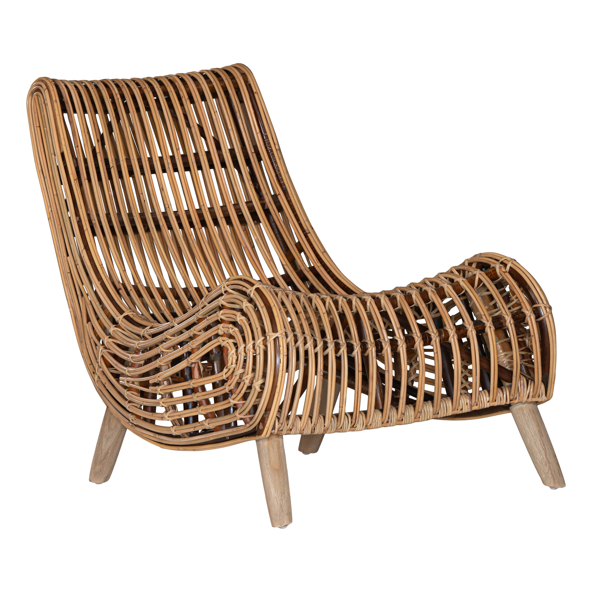 A sculptural natural rattan lounge chair with a curved, low-profile silhouette and sleek wooden legs. The woven design adds texture, while the deep seat and ergonomic shape offer comfort and relaxation