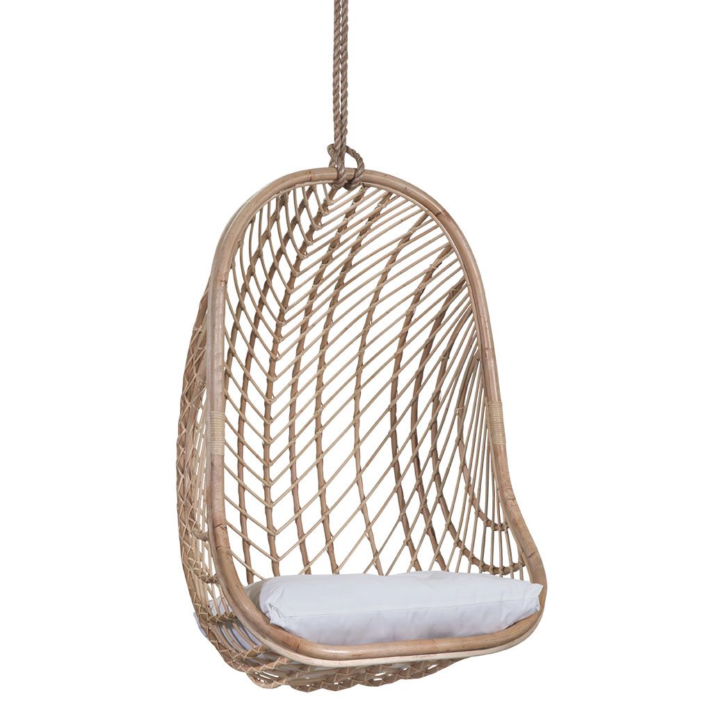 Natural rattan hanging egg chair with a plush white cushion, featuring a woven open-weave design and sturdy rope for a stylish and relaxing indoor or outdoor seating option
