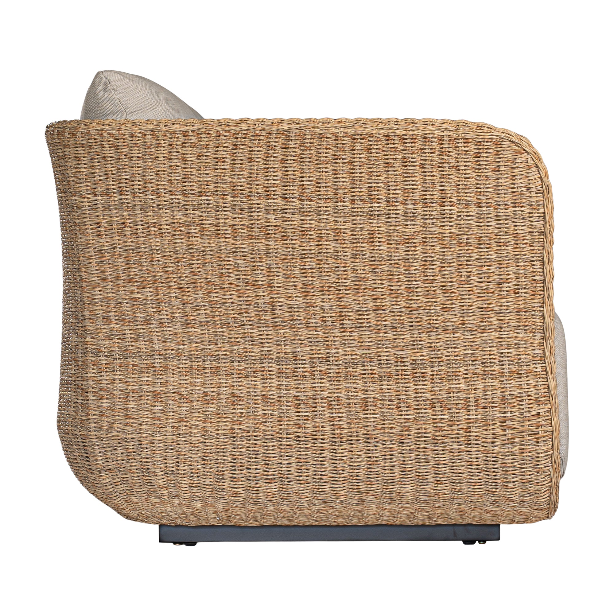 Natural rattan three seater with plush barley cushions, offering a blend of comfort and contemporary coastal style