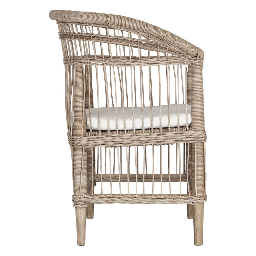 A beautifully crafted natural rattan armchair with an open-weave design and a white cushioned seat, perfect for adding a relaxed coastal touch to any space.