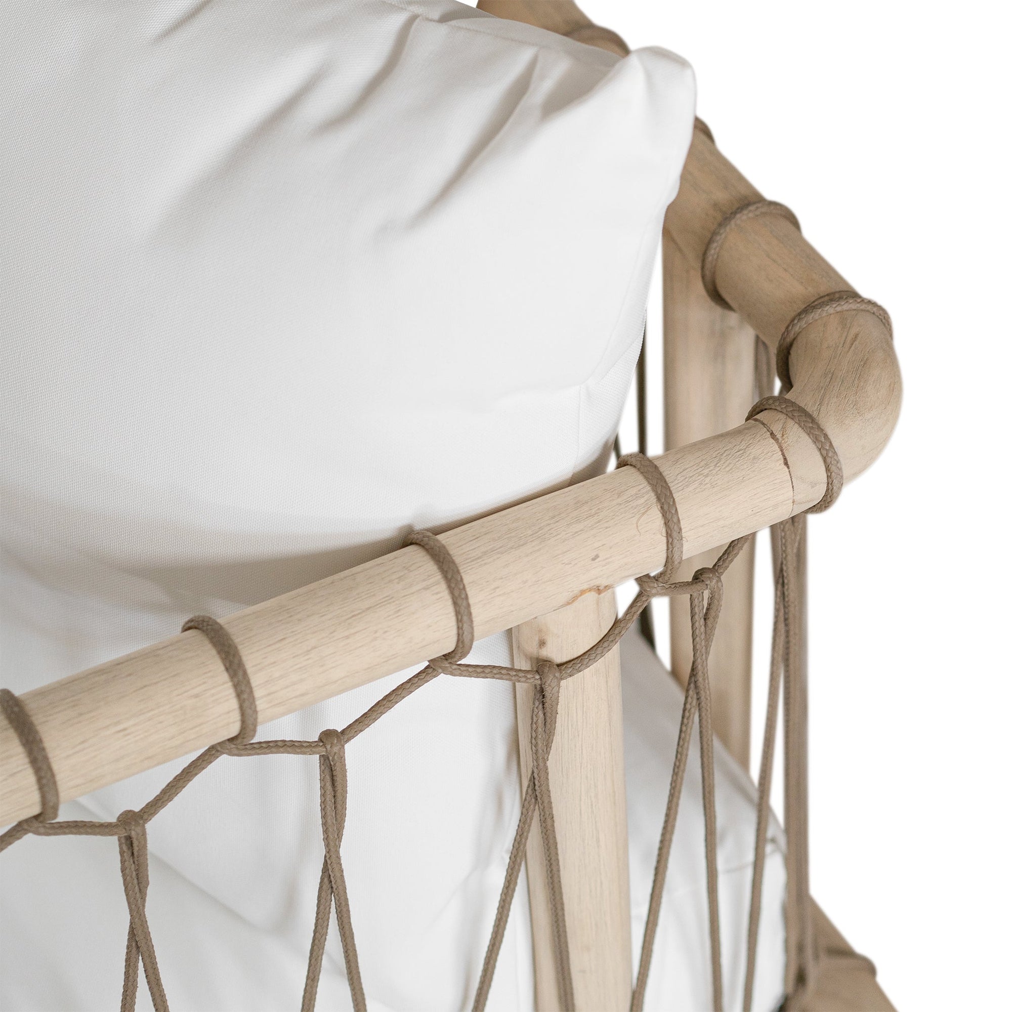 Natural rope lounge chair with white cushions, featuring a light timber frame and modern coastal aesthetic.