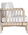 Natural rope lounge chair with white cushions, featuring a light timber frame and modern coastal aesthetic.
