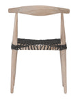 Natural timber dining chair with a black woven seat, showcasing rustic craftsmanship and contemporary design