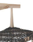 Natural timber dining chair with a black woven seat, showcasing rustic craftsmanship and contemporary design