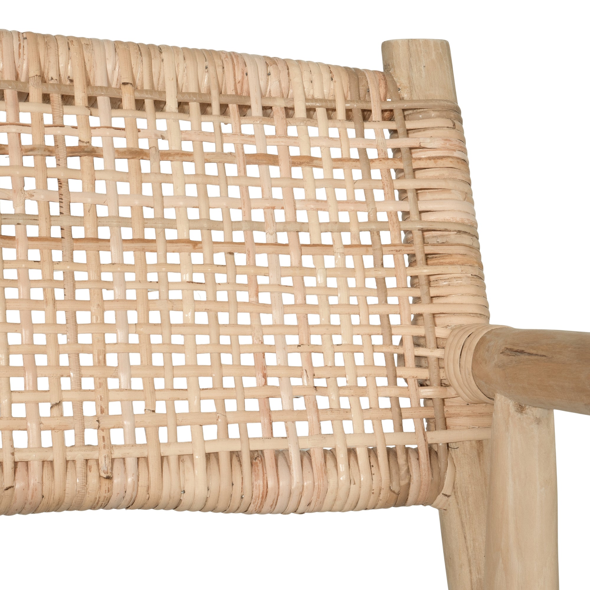 Natural rattan armchair with rustic branch frame, perfect for adding a touch of organic texture to any dining space