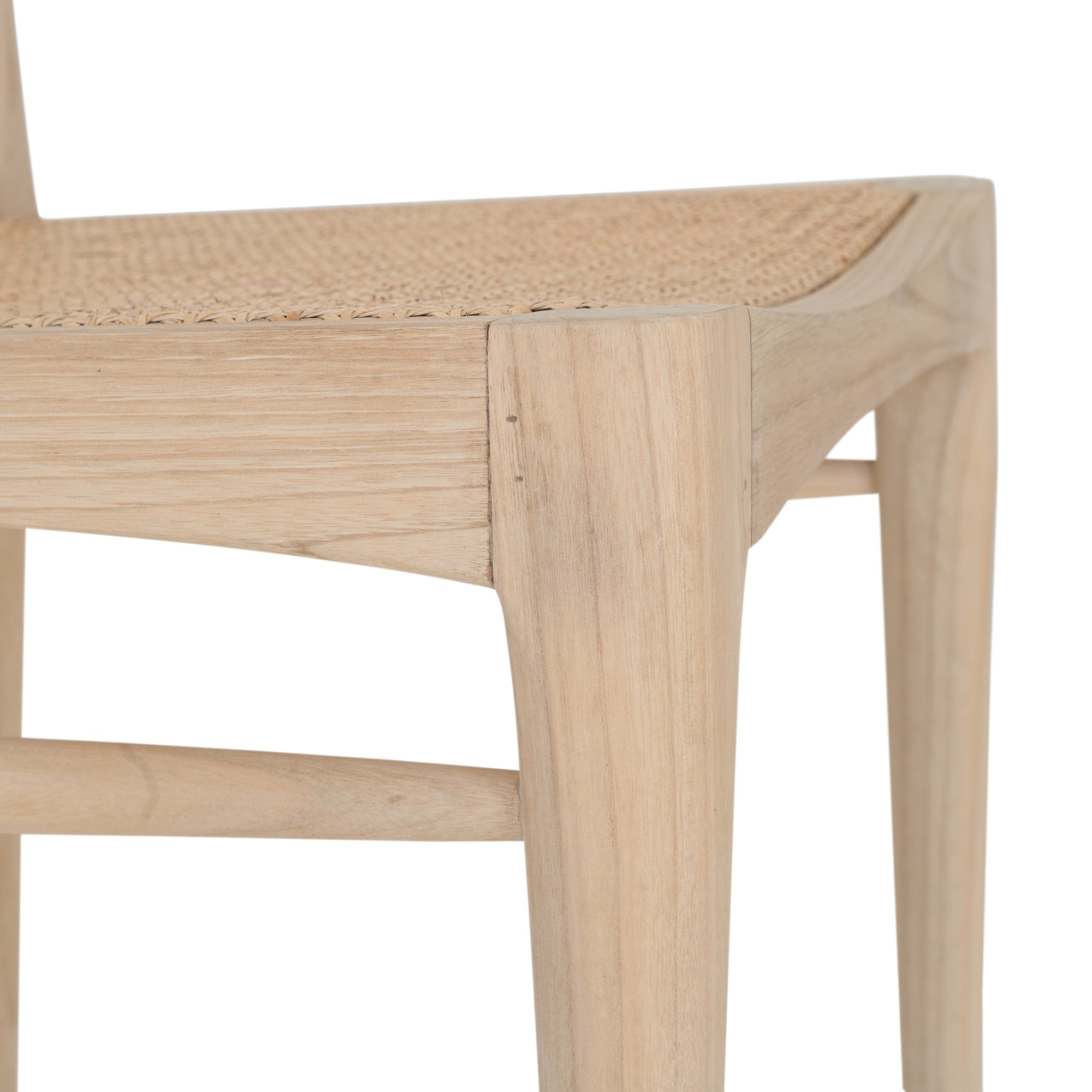 Natural timber dining chair with woven cane seat and curved backrest, ideal for relaxed, coastal-inspired dining spaces