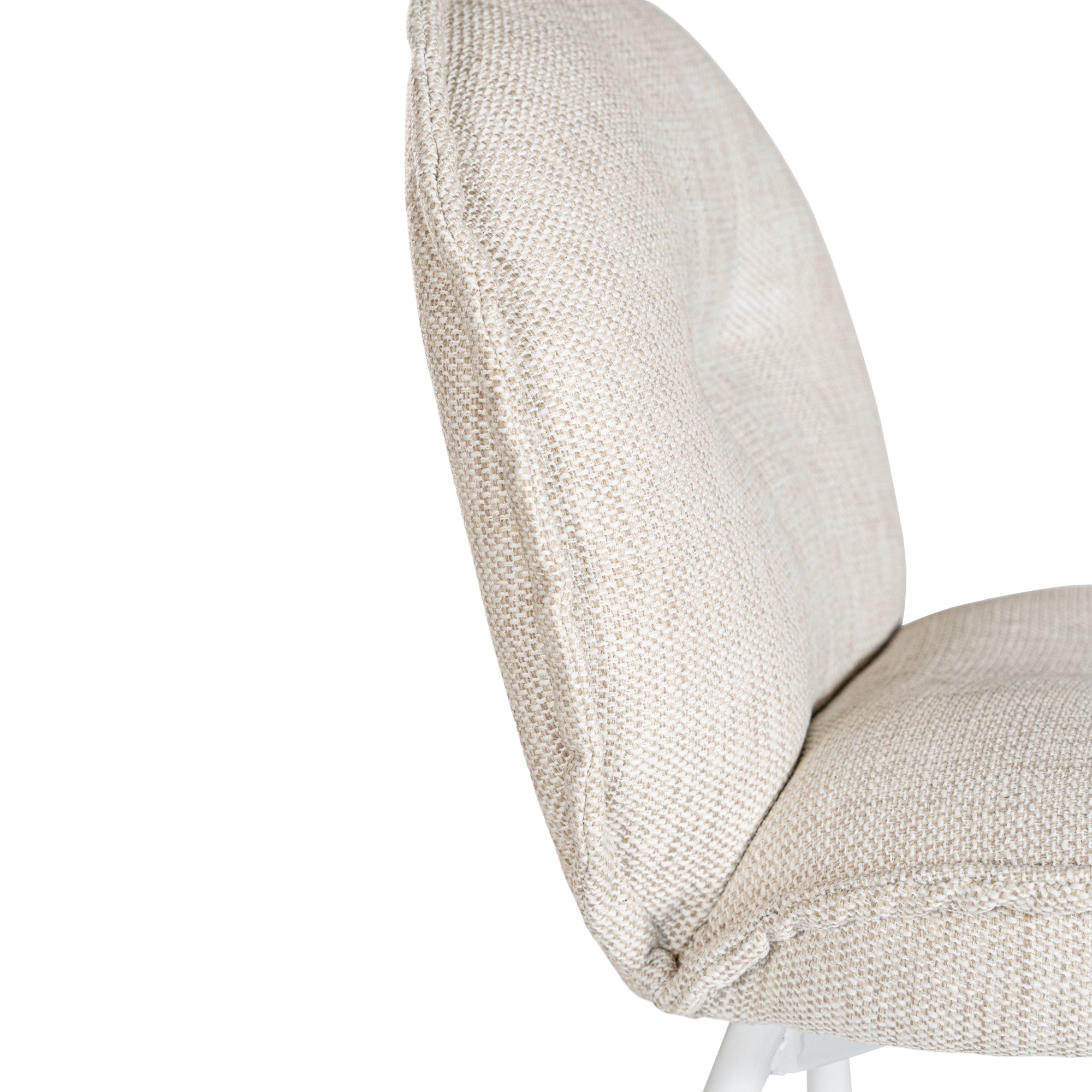 Contemporary natural upholstered dining chair with a plush, rounded backrest and cushioned seat, supported by sleek black metal legs for a sophisticated modern look