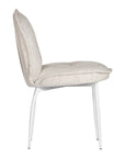 Contemporary natural upholstered dining chair with a plush, rounded backrest and cushioned seat, supported by sleek black metal legs for a sophisticated modern look