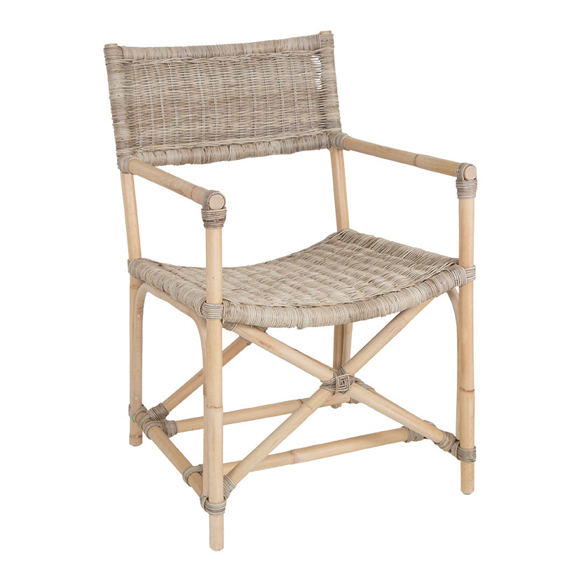 Natural wicker armchair with armrests and a sturdy cross-frame base, showcasing a contemporary design suitable for indoor or outdoor dining spaces.