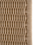 Dining chair featuring a natural wood frame with a curved backrest and a handwoven rope seat, offering a blend of comfort and organic elegance.