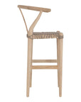 A natural wood bar stool with a handwoven seat, featuring a curved backrest and a minimalist frame. Perfect for coastal and contemporary interiors, adding texture and warmth to any space