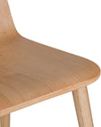 The Kulala Living natural wood dining chair features a sleek, curved seat with a natural wood grain finish. Its minimalist design and sturdy legs make it a stylish and versatile addition to any modern dining space