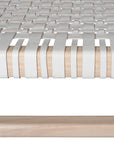 A beautifully crafted natural wood low stool with a woven white leather seat, perfect for adding a touch of relaxed elegance to any space