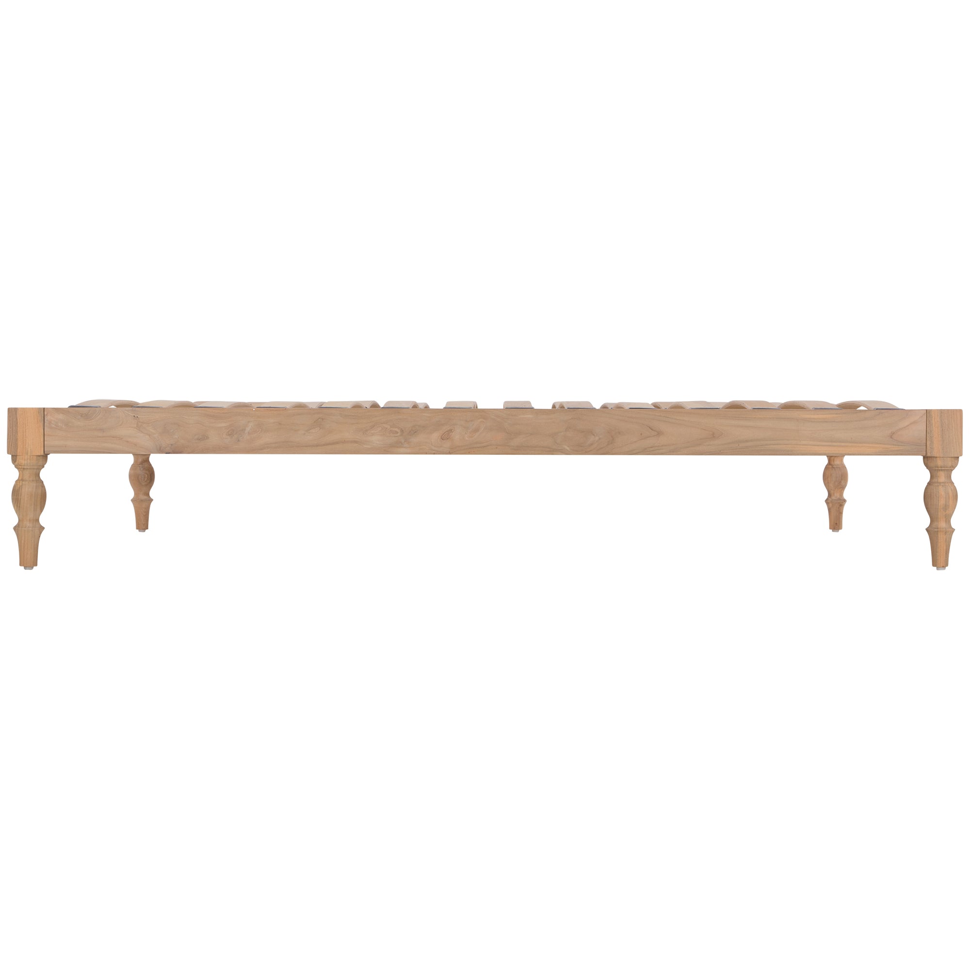 Natural wood platform bed with turned legs styled with white linen bedding and textured throw
