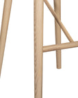 Natural wooden bar stool with sleek modern design and contoured seat, perfect for contemporary kitchen or bar settings