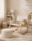 Nayasa timber rocking chair with white woven seat styled in a soft neutral nursery with textured rug and natural light