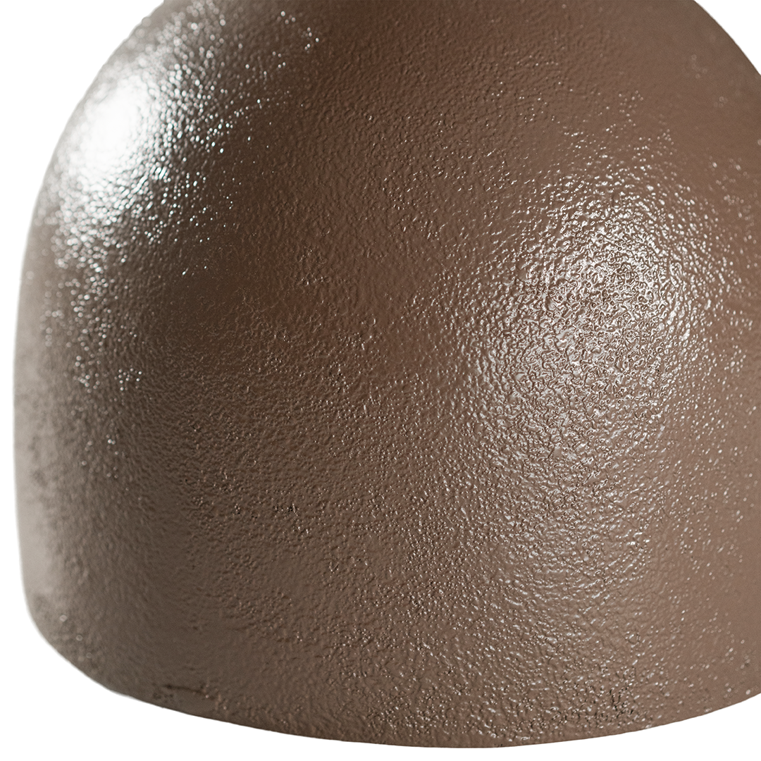 Chocolate brown Neri side table with a rounded pedestal base and smooth circular top, shown against a neutral background.