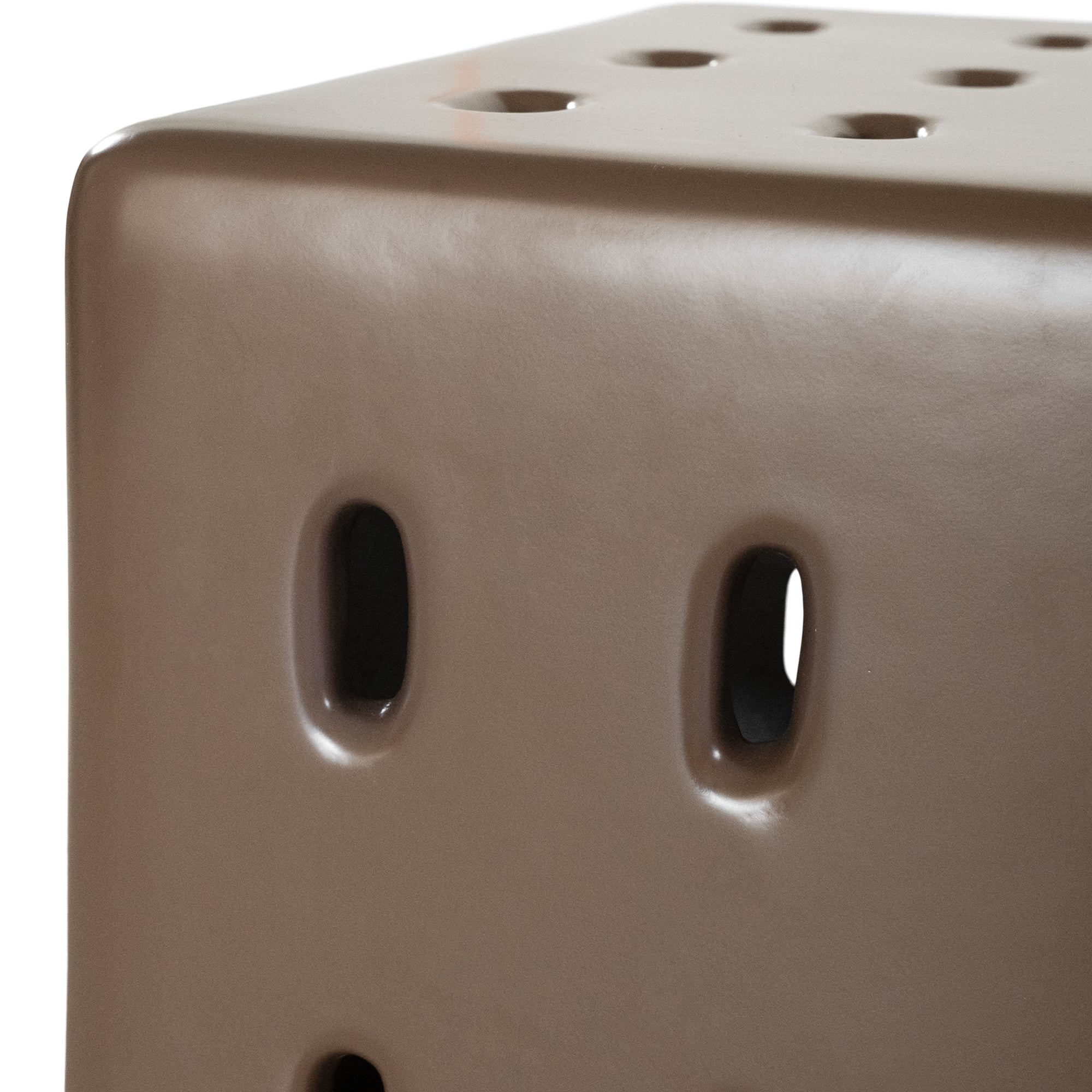 Concrete cube-shaped bedside table with modern cut-out design