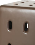 Concrete cube-shaped bedside table with modern cut-out design