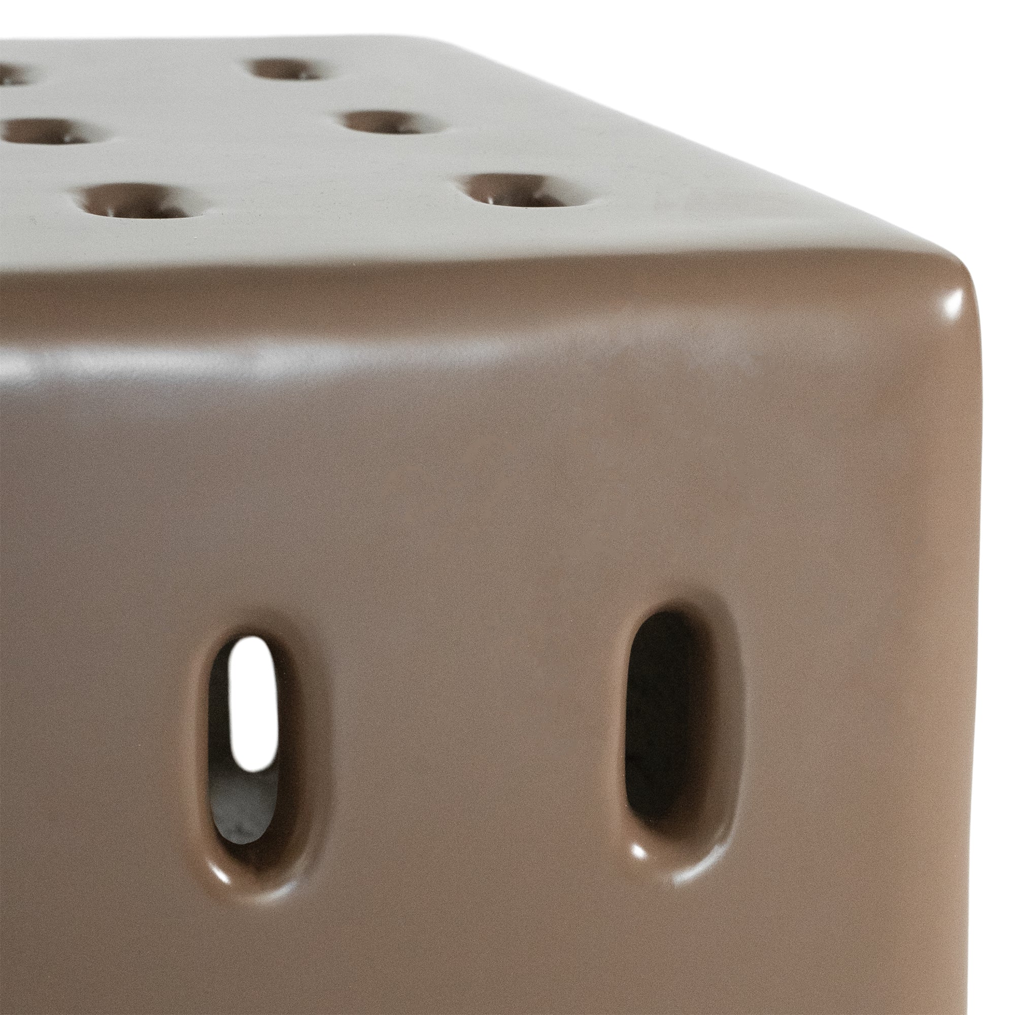 Concrete cube-shaped bedside table with modern cut-out design