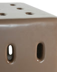 Concrete cube-shaped bedside table with modern cut-out design
