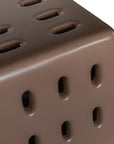 Concrete chocolate side table with modern cut-out design